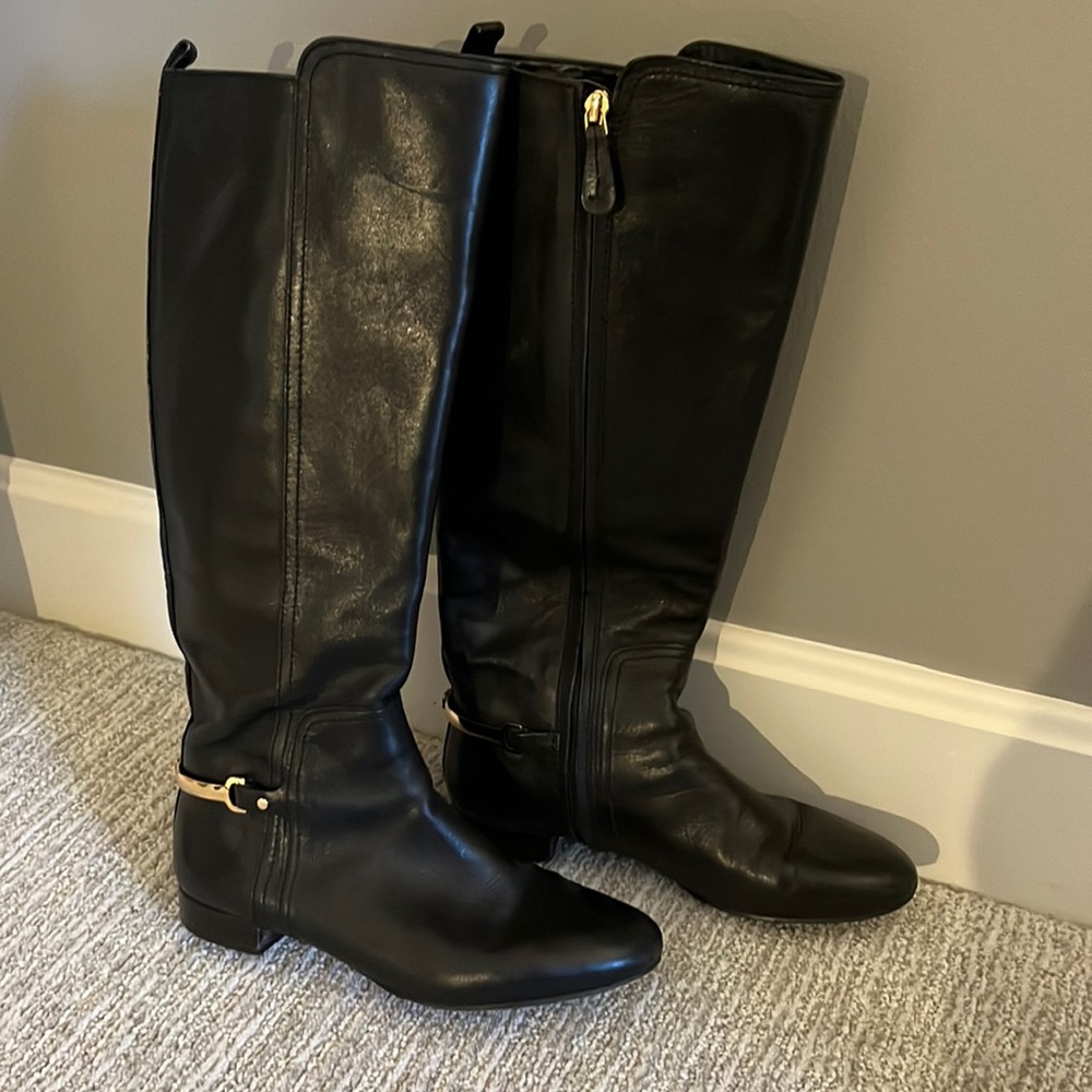 knee-high, flat, leather boots, black with gold stirrups.